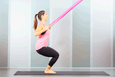 Proper form for resistance band lat pull-down in chair pose