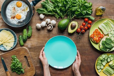 empty plate and ingredients for breakfast