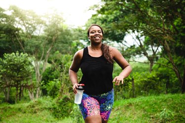 woman doing walking and yoga workout outside
