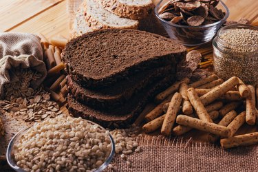 Wooden table full of fiber-rich wholegrain foods, perfect for a balanced diet