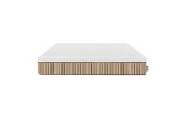 A white and tan striped mattress on a white background