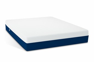 A white and navy blue mattress on a white background