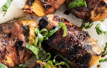 Prosciutto-Wrapped Grilled Peaches on a plate