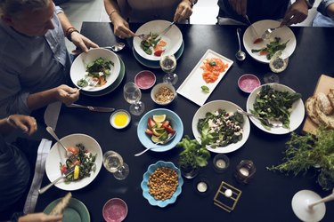 High angle view of friends eating food at table